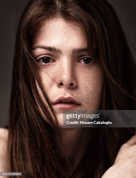 freckled beautiful young woman crying. - tears happiness stock pictures, royalty-free photos & images
