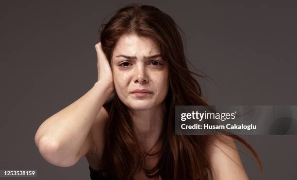 freckled beautiful young woman crying. - woman crying stock pictures, royalty-free photos & images