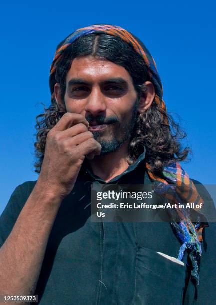 Portrait of a saudi man with long hair, Jizan province, Addayer, Saudi Arabia on June 10, 1923 in Addayer, Saudi Arabia.