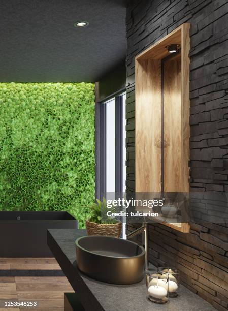 luxurious modern home spa bathroom with matte black tiles and green moss plant wall - moss imagens e fotografias de stock