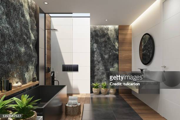 spa bathroom in luxurious modern villa with huge natural rock wall - vegetação mediterranea imagens e fotografias de stock