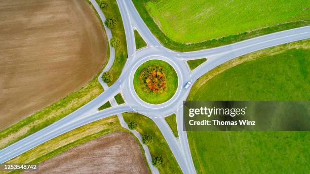 aerial view of crossroads at a roundabout - aerial single object stock pictures, royalty-free photos & images