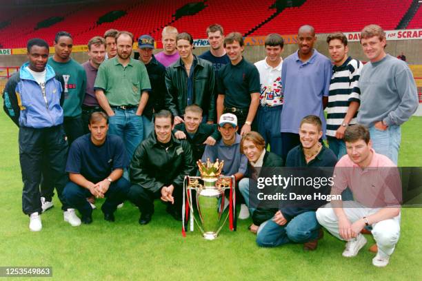 Take That pose with Manchester United players and the Premier League trophy at Old Trafford in 1995