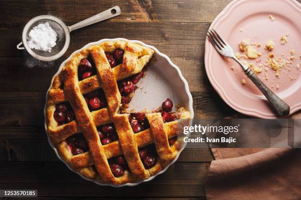 freshly baked cherry pie with lattice top - rustic plate overhead stock pictures, royalty-free photos & images