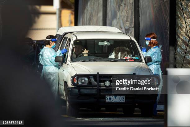 People are give a COVID-19 test at a pop-up site in Fawkner on July 01, 2020 in Melbourne, Australia. Victorian premier Daniel Andrews on Tuesday...