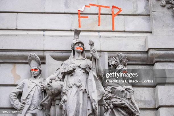 Statues at New York City Hall defaced and painted. Statues were taped over their eyes, mouth and nose with the letters, "FTP" above the statues....