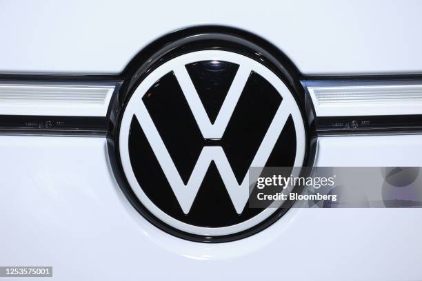 The VW badge on a VW ID.7 electric automobile on display at the Volkswagen AG annual general meeting in the CityCube Berlin conference centre in...