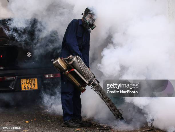 Health worker uses an anti-mosquito fumigation machine to control mosquitoes in Colombo, Sri Lanka. May 10, 2023. The dangerous dengue virus is...