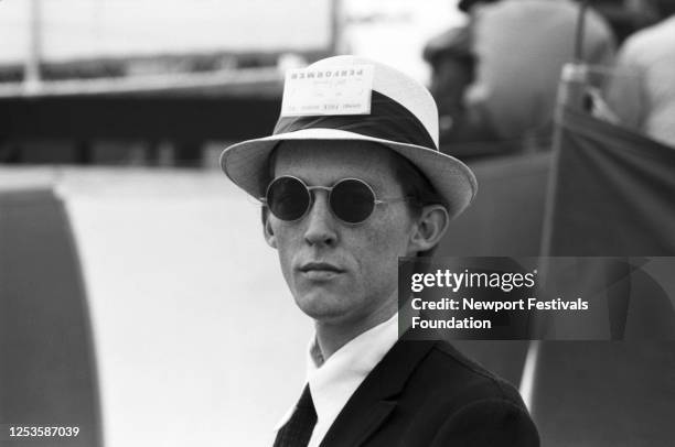 Harmonicist, musician, and writer Mel Lyman poses for a portrait at backstage at the Newport Folk Festival in July, 1965 in Newport, Rhode Island....