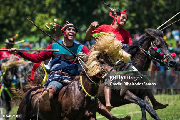 pasola horsemen attack - sumba stock pictures, royalty-free photos & images