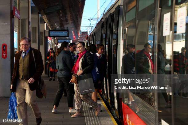 Commuters make their way onto the light rail platform at Central Station on July 01, 2020 in Sydney, Australia. Public transport capacity has...