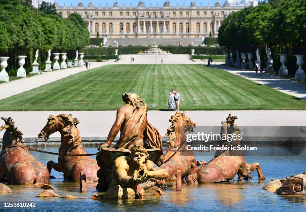 Water basin called Parterre d'eau with the palace of Versailles in the background, île de France, on June 23, 2020 in Paris, France.
