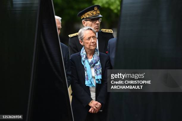 France's Prime Minister Elisabeth Borne and Ile-de-France region Prefect Marc Guillaume attend a ceremony at the Luxembourg Gardens to mark the...