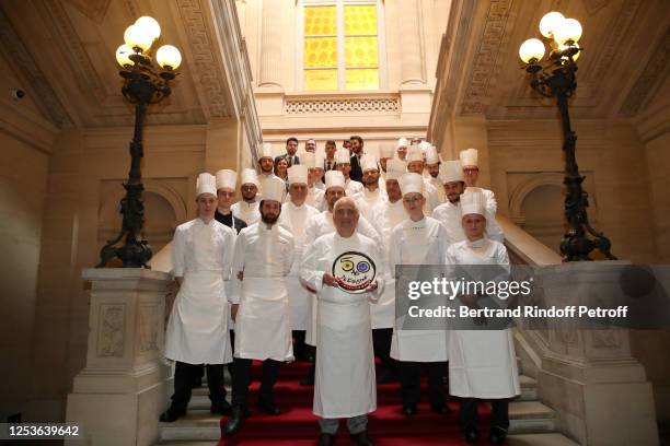 Chef Guy Savoy celebrates 50 years of career with his brigade in his 3 Stars Restaurant, "Guy Savoy - Monnaie de Paris" on July 01, 2020 in Paris,...