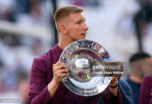 Mason Terry of the West Ham United U18 sqaud holds the Premier League Division South league trophy during the Premier League match between West Ham...