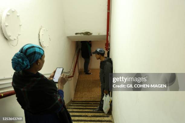 People enter a bomb shelter in the southern Israeli city of Ashdod, on May 10 as rockets are launched toward Israel from the Gaza strip. Israel's...