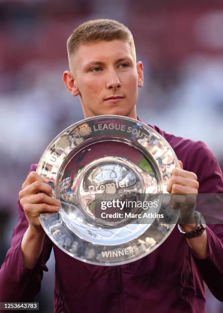 Mason Terry of the West Ham United U18 sqaud holds the Premier League Division South league trophy during the Premier League match between West Ham...