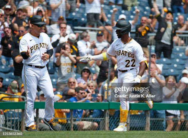 Andrew McCutchen of the Pittsburgh Pirates celebrates after hitting a two run home run in the third inning against the Colorado Rockies at PNC Park...