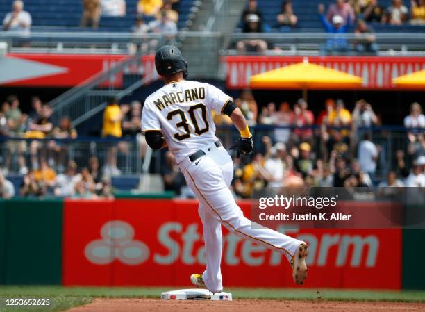 Tucupita Marcano of the Pittsburgh Pirates rounds second after hitting a solo home run in the second inning against the Colorado Rockies at PNC Park...