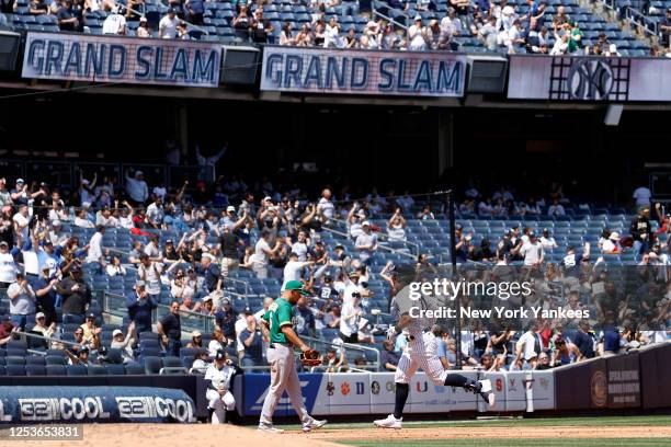 Anthony Volpe of the New York Yankees rounds the bases after hitting a grand slam during the game against the Oakland Athletics at Yankee Stadium on...