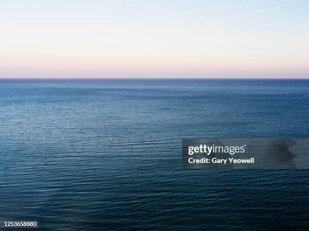 elevated view out to sea - turquoise colored foto e immagini stock