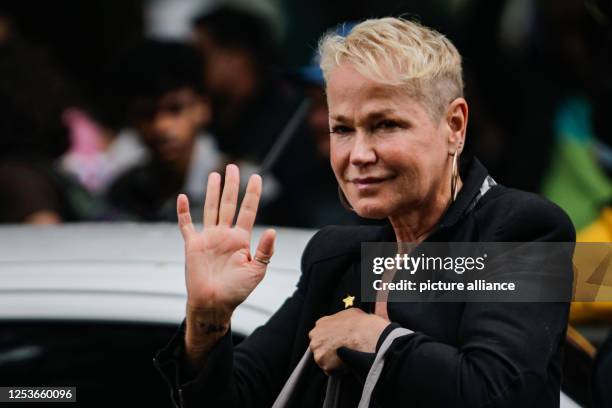 May 2023, Brazil, Sao Paulo: Brazilian ex-model Xuxa waves as she arrives for the wake of singer Rita Lee. Lee, the Brazilian "Queen of Rock," died...
