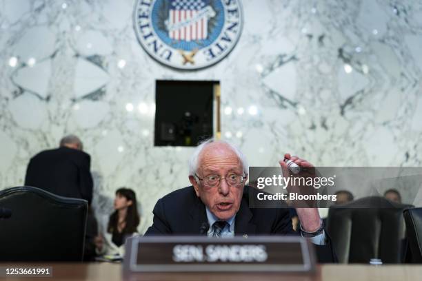 Senator Bernie Sanders, an Independent from Vermont and chairman of the Senate Health, Education, Labor, and Pensions Committee, holds a vial of...