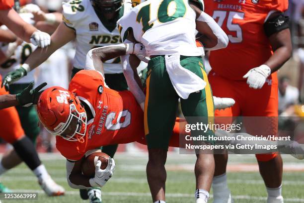 Sam Houston State running back Noah Smith is stopped just short of the goal line by North Dakota State safety Dom Jones during the first quarter of a...