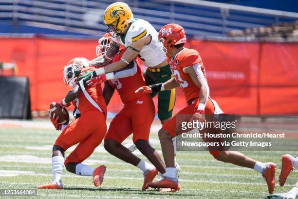 Sam Houston State defensive back Jaylen Thomas comes down with a loose ball, taking it away from North Dakota State wide receiver Christian Watson ,...