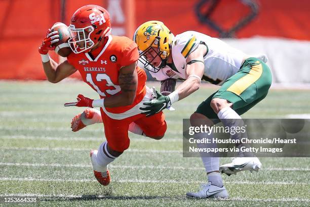 Sam Houston State defensive back Isaiah Downes intercepts a pass intended for North Dakota State wide receiver Christian Watson during the first...