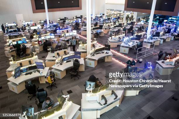 Communications officers work in the Harris County 911 Call Center Tuesday, May 18, 2021 in Houston. Harris County is doing a pilot program on Shot...