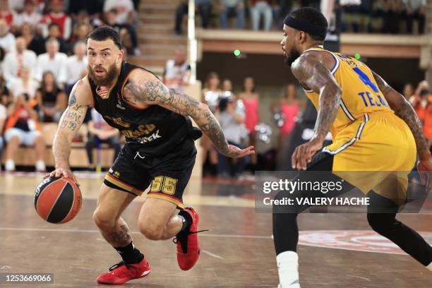 Monaco's US guard Mike James fights for the ball with Maccabi's Spanish point guard Lorenzo Brown during the Euroleague quarter final basketball...