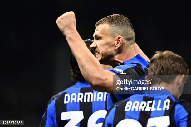 Inter Milan's Bosnian forward Edin Dzeko celebrates after opening the scoring during the UEFA Champions League semi-final first leg football match...