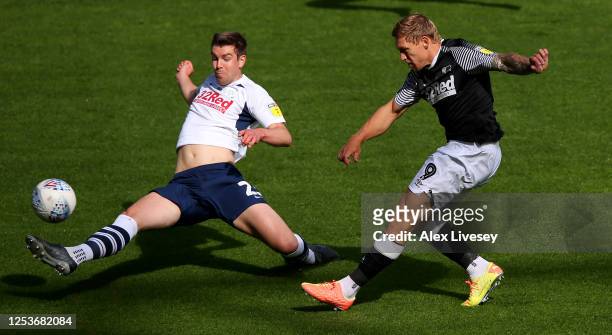 Martyn Waghorn of Derby County is challenged by Paul Huntington of Preston North End during the Sky Bet Championship match between Preston North End...