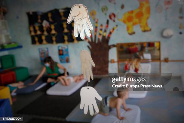 Children are seen preparing to rest at the Gloria Fuertes Nursery School, on the day of its reopening after the break due to the coronavirus at the...