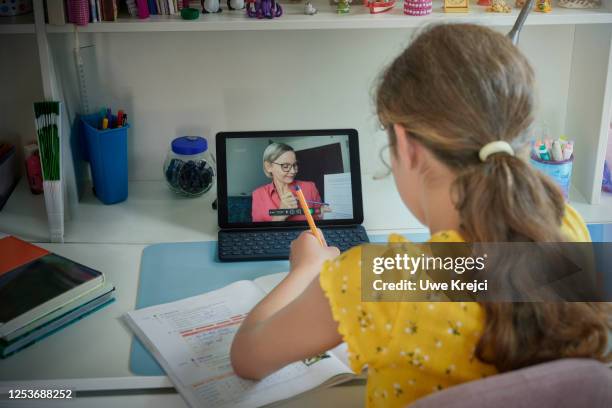 girl attending online school class - teacher zoom stock pictures, royalty-free photos & images