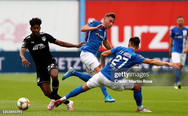 Daniel Patrik Hanslik of Rostock challenges Boubacar Barry of Uerdingen during the 3. Liga match between Hansa Rostock and KFC Uerdingen at...