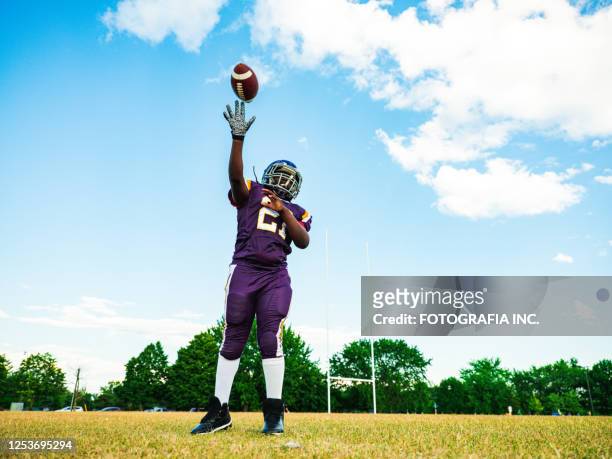 junior football player during game - yankees spring training stock pictures, royalty-free photos & images