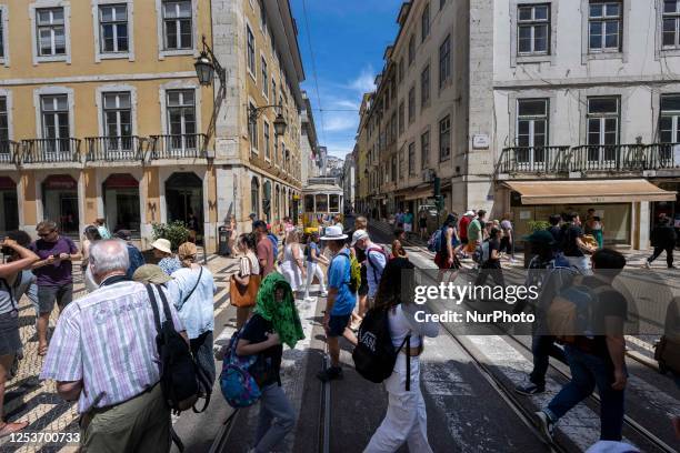 People are seen walking along one of the streets in the neighborhood of Baixa, Lisbon. 02 May 2023.