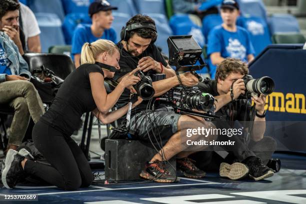 photographers shooting on court - sports photographer stock pictures, royalty-free photos & images