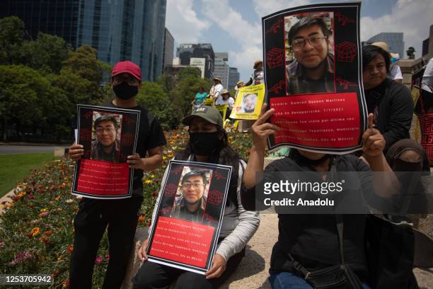 Relatives of missing people hold portraits during a protest to demand justice on Mother's Day, in Mexico City, Mexico on May 10, 2023. Relatives of...