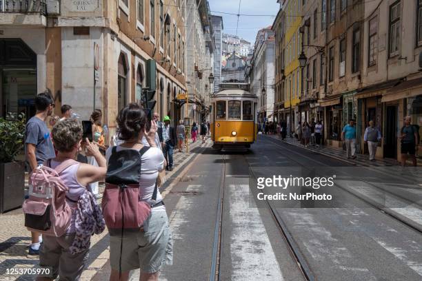 Tram is seen passing through one of the streets in the neighborhood of Baixa, Lisbon. May 02, 2023.