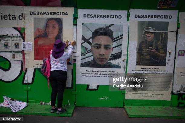 Relative of a missing person places a portrait during a protest to demand justice on Mother's Day, in Mexico City, Mexico on May 10, 2023. Relatives...