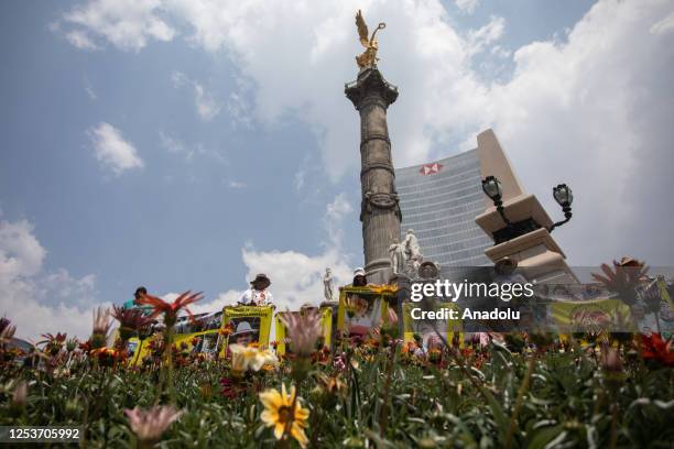 Relatives of missing people hold portraits during a protest to demand justice on Mother's Day, in Mexico City, Mexico on May 10, 2023. Relatives of...