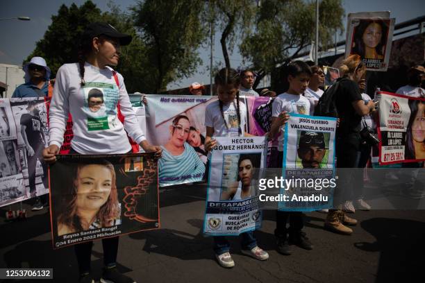 Relatives of missing people hold portraits during a protest to demand justice on Mother's Day, in Mexico City, Mexico on May 10, 2023. Relatives of...