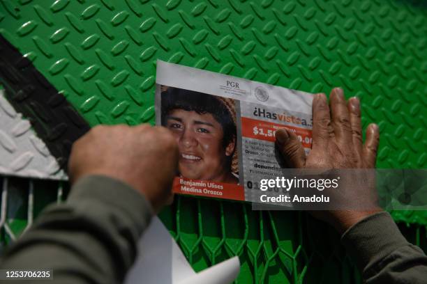 Relative of a missing person places a portrait during a protest to demand justice on Mother's Day, in Mexico City, Mexico on May 10, 2023. Relatives...