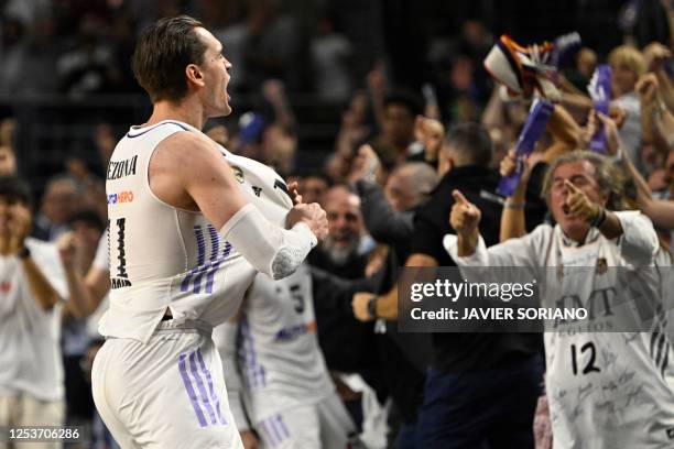 Real Madrid's Croatian forward Mario Hezonja celebrates his team's win at the end of the Euroleague quarter final basketball match between Real...