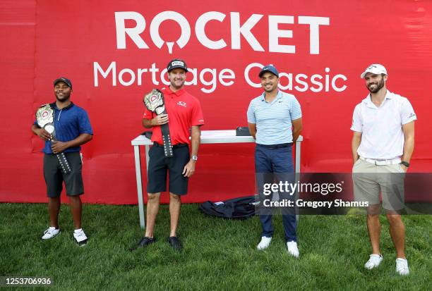 Harold Varner III of the United States and Bubba Watson of the United States celebrate with their trophy belts after defeating Jason Day of Australia...