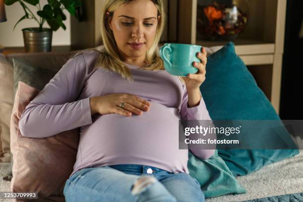 a hot beverage and a comfortable bed to enjoy her/his movements - punting stock pictures, royalty-free photos & images