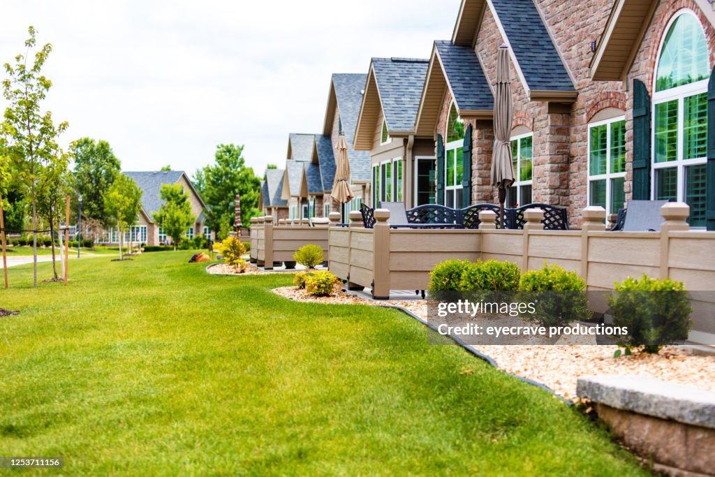 Groups of of Townhouses with Healthy Green Yards on a Sunny Summer Day